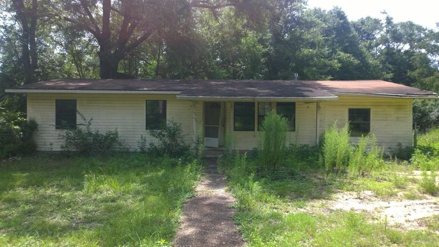 almost full acre lot conveniently located in Crestview - just north of the High School. Tremendous potential for Buyer who has vision and not afraid to do a little work on this ''fixer upper'' - HUGE shed in the back too!