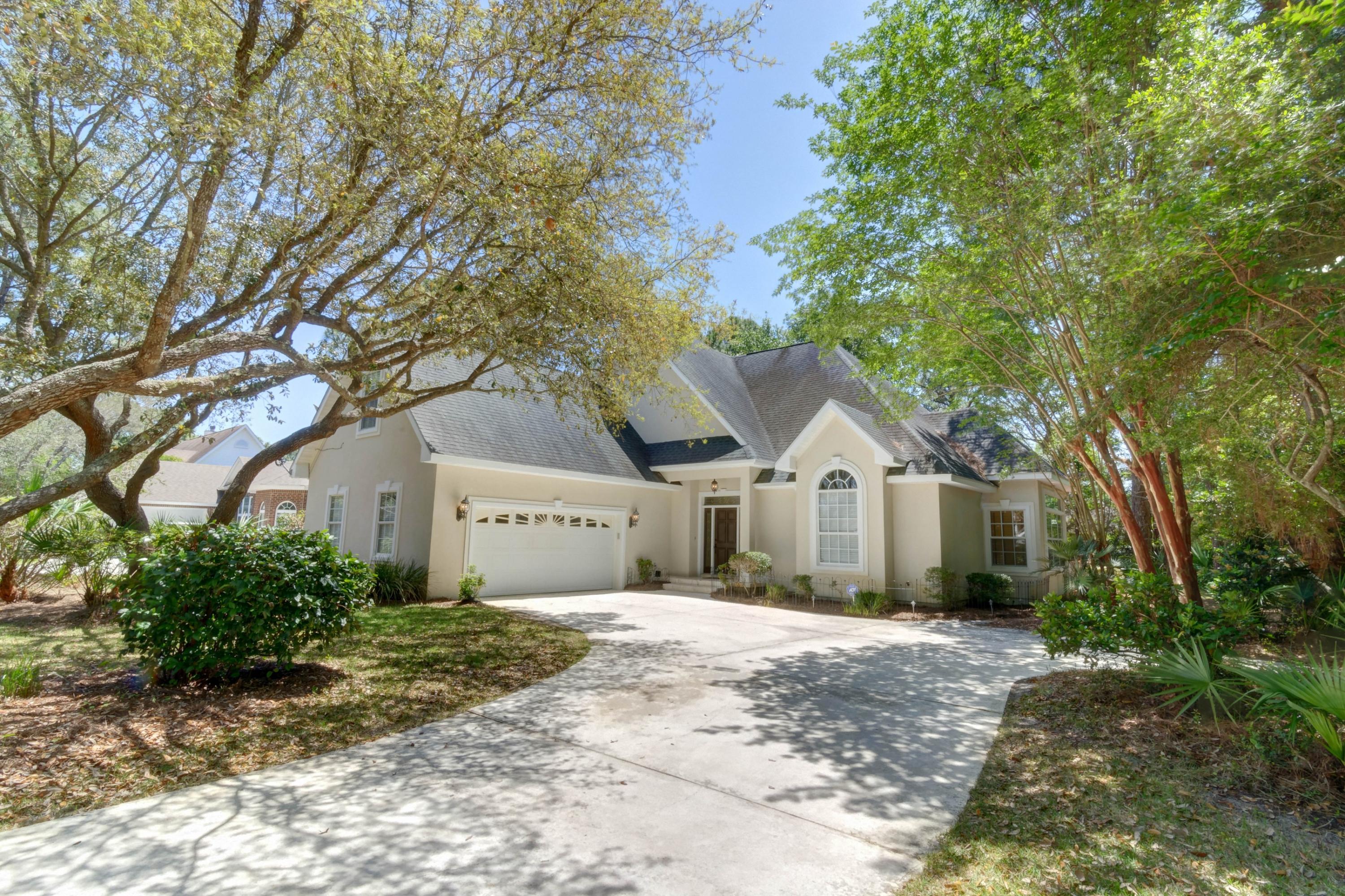 Impressive 2-story home in highly desirable Sound Forest situated on double lot! This 4-bedroom, 2.5 bath beauty includes a .72 acre corner lot making it one of the largest lots in the neighborhood! The entryway is lined with travertine tile, columns and bull nose archways with the elegant step-down formal dining off to the right. The 20' soaring ceiling creates the focal point of the home by emphasizing the spacious family room with fireplace, custom built-in book cases and ample cabinet storage. The separate eat-in kitchen features granite counter tops, island, newer GE stove, oven and microwave and custom maple cabinets. The surround wall of windows brings in plenty of natural light with a peaceful view of the backyard (a long transom windows keep the room bright).