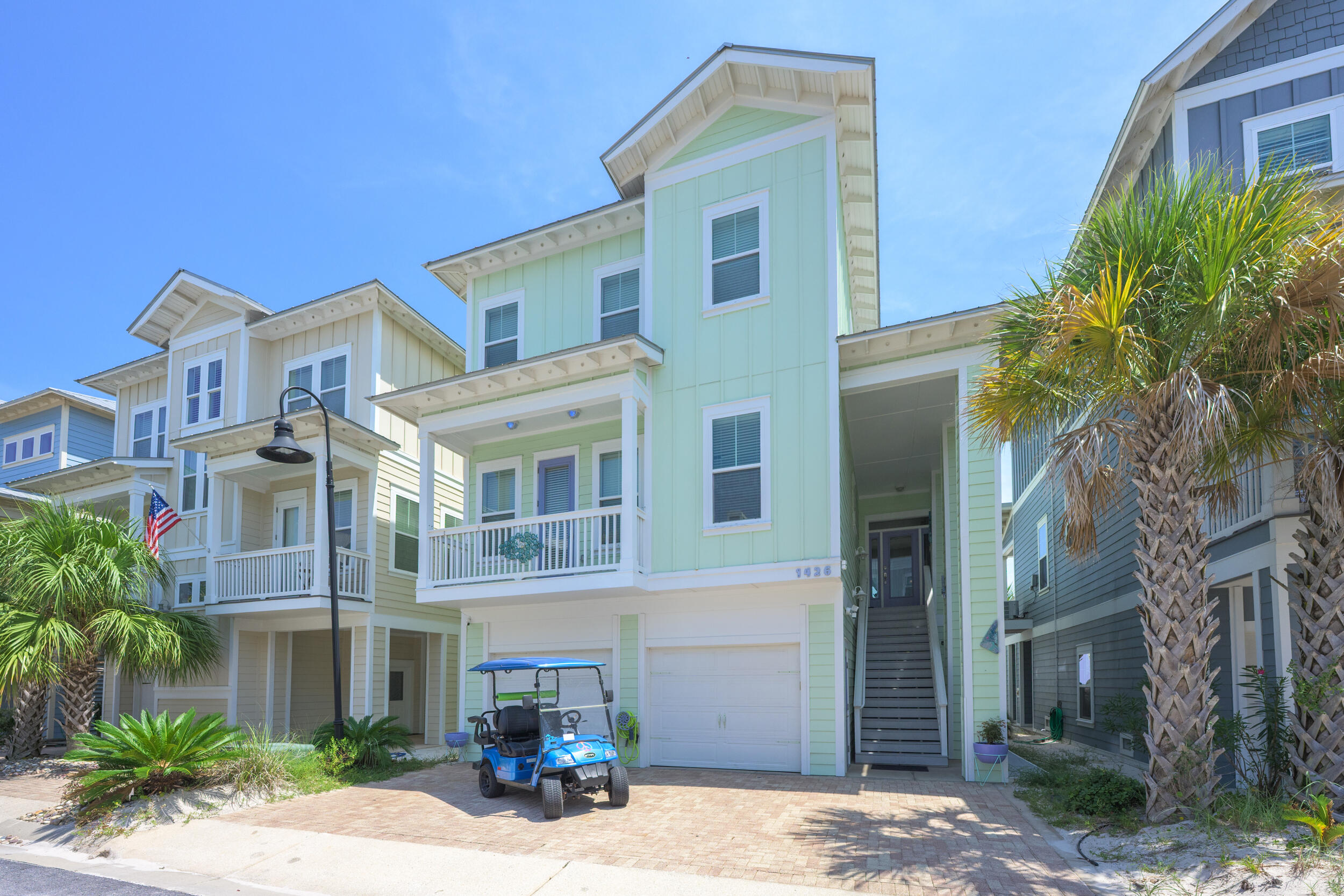 Welcome to By the Sea, a gated community on Navarre Beach offering deeded sound access, a sparkling community pool, and the perfect blend of coastal luxury and convenience! The property has consistently generated over $100K in annual rental income for the past three years, making it an outstanding primary residence, second home, or investment opportunity. Conveying with a golf cart (2023 battery) and two brand-new 2024 AC units, this home is move-in and rental-ready. This exceptional 4-bedroom, 4.5-bathroom home enjoys one of the neighborhood's most desirable locations, backing up to over 300 acres of preserved land with sweeping views of the Santa Rosa Sound. From here, you're just a short walk or bike ride to the pool, Gulf beach access 37B, or the Gulf Islands National Seashore with it s 8 miles of pristine, protected shoreline. Step inside to find an open floor plan where natural light and water views create a relaxed coastal ambiance. The chef's kitchen is a true highlight, featuring a spacious island with breakfast bar, granite countertops, stainless steel appliances, and a pantry. The main living area flows seamlessly to a covered deck overlooking the sound and leads to a private outdoor retreat. Here, you'll find a large covered patio, outdoor shower, fire pit, and unobstructed views of the sound! The primary suite is the only bedroom on the second floor, offering a peaceful escape with its walk-in closet, private balcony, and bathroom complete with double vanities, soaking tub, spacious walk-in shower, and private water closet. Upstairs, three additional bedrooms each feature generous closets and private en suite bathrooms. A full laundry room with cabinetry and sink adds convenience to the third level. The home also features an oversized 2 car garage that could double as a workshop. Whether you're seeking a serene coastal lifestyle or a proven income-producing property, this home embodies the best of quaint island life on Navarre Beach!