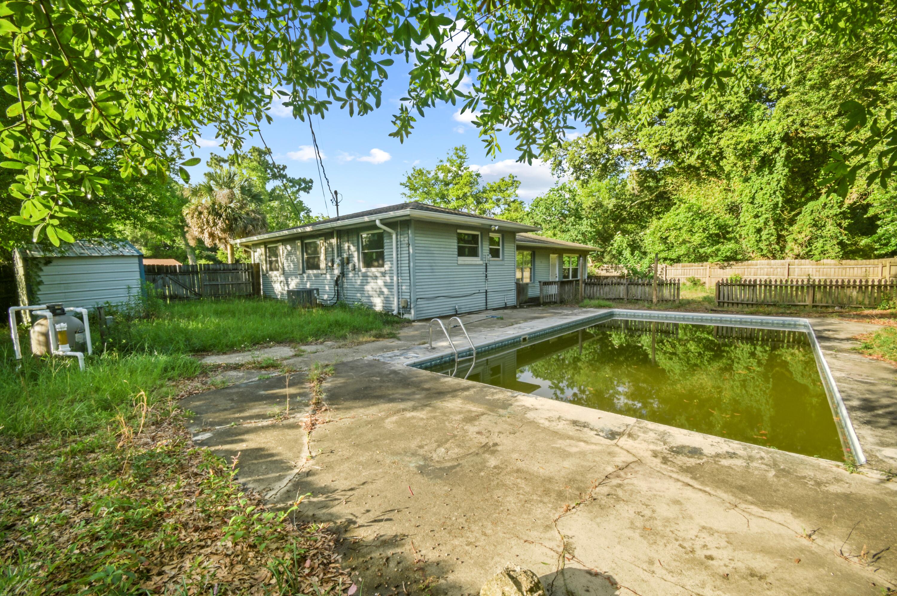 Cheapest POOL HOME in the whole Emerald Coast! Seller is in the process of cleaning the pool for the summer. This spacious home is positioned on a large corner lot in a neighborhood WITH SIDEWALKS! A short drive to everything Pensacola has to offer, this house screams convenience! The split floorplan separates the bedrooms and full bathrooms from the living room, dining room, half bath, kitchen, and LARGE bonus room that is easily convertible to a 4th bedroom/office. The interior needs some cosmetic work - new flooring, paint, and ceiling tiles. Aside from that, the major items are taken care of - 2020 roof, 2020 windows, 2015 water heater, 2020 HVAC, 2020 gutters, updated wiring, and a 2022 pool liner. Sliding glass door is operational - owner just doesn't like all the light that comes through. Seller will make all repairs necessary for financing/insurance. STOP BY AND BRING AN OFFER - THIS IS A HUGE OPPORTUNITY! Seller will make all repairs necessary for financing/insurance. STOP BY AND BRING AN OFFER - THIS IS A HUGE OPPORTUNITY!