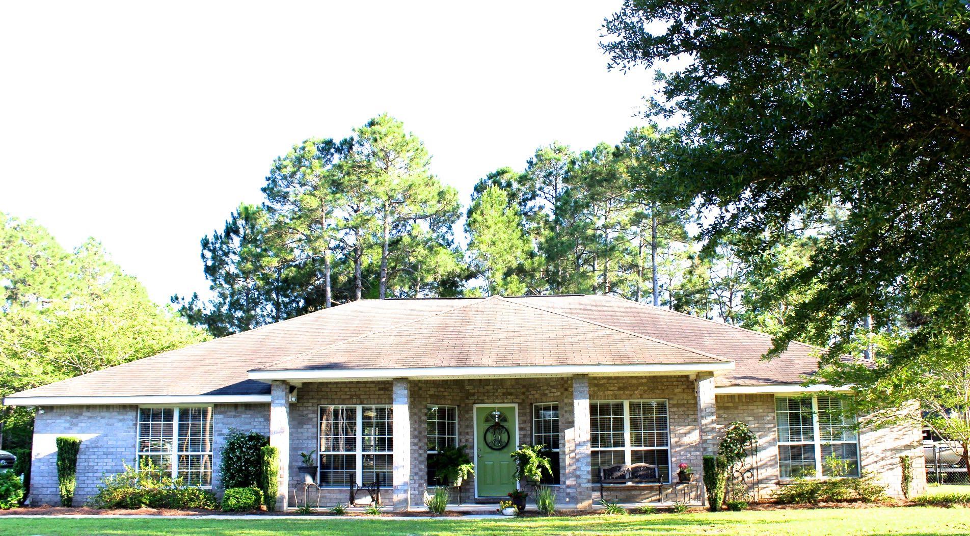 Quintessential Florida Living and Entertainer's Dream!! This IMMACULATE Holley by the Sea home is extremely unique in design and sits on a pristine Park-Like corner lot in this well-established community. This home has been maintained and cared for meticulously and it shows! Vaulted ceilings and gorgeous archways greet you when you enter from the spacious and welcoming front porch. The spacious kitchen is perfect for entertaining and provides plenty of room for you, your family, and guests. There are 3 spacious guest rooms and a very LARGE Master Suite that has its own access to the rear lanai. A Jack-and-Jill bathroom connects 2 of the roomy bedrooms and a convenient Half-bath is nearby for guests. The Park-Like backyard is perfect for those summer parties or simply to relax!