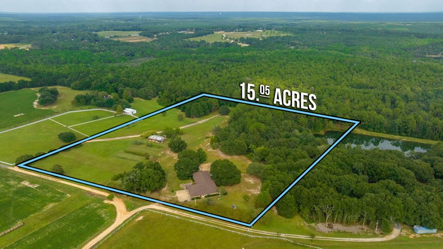 WOW! RARE FIND! 15.05 ACRE Farmstead with POND loaded with fish! BRAND NEW ROOF on this 3526 sqft brick 4 bd 3.5 bath home with wraparound porch and  oversized 3 car garage! There is an old Pole Barn with workshop and greenhouse area and even an attached chicken coop! This Beautiful parcel of land has so many potential uses! Whether you want to farm, or just grow your own sustainable kitchen garden , or setup the property for horses and livestock, you'll have so much flexibility! The pond is located on the back corner of the property and is the perfect spot for a relaxing and fishing.  Located a short distance off the paved portion of Walker Drive, an area which features several newer construction properties, and in a convenient location close to town. The home itself features .