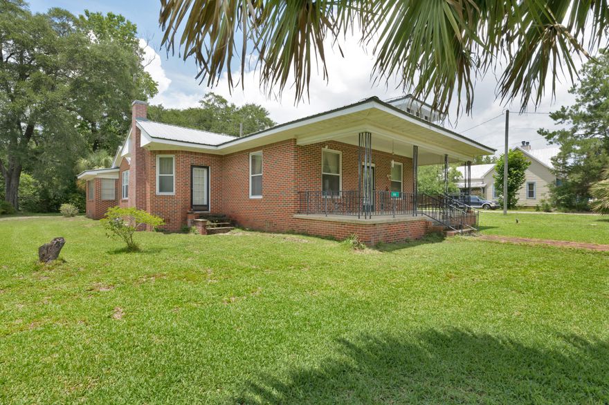 Beautiful historic brick home in the heart of Defuniak Springs on a large corner lot. All appliances included in sale, new back porch, metal roof in great condition, Florida room with AC , this home has two living areas as soon as you enter the front door and original cabinets in the kitchen!Home has a detached 2 car garage, another small shed and 2 driveways, one on each side of the home. There is plenty of room for storage and workspace.Adorable front porch with new concrete and a nice walkway to the mailbox and main road.There is so much character in this unique home, it is truly a great, sound home to update or enjoy as is!