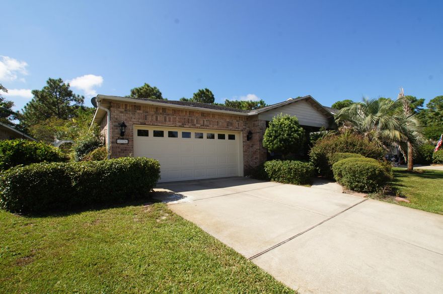 This 3 bedroom 2 bath brick home is located in the desirable Escada neighborhood. A one level residence featuring tiled flooring in the entry, hallway, baths and 1 guest bedroom, engineered hardwood flooring in the living & dining area, crown molding throughout except 2 guest bedrooms, large laundry space, huge master walk-in-closet, tub and separate shower in master bath, a nice fenced in back yard and screened-in back porch and a 2 car garage. Escada is a great full time community close enough to walk to the schools along the Greenway Trail and not far from the beach! There are ponds for fishing with fountains, a swimming pool, community room, tennis court, area to play basketball and swings for the kids! This is the perfect place for the whole family! This is an AS IS sale.