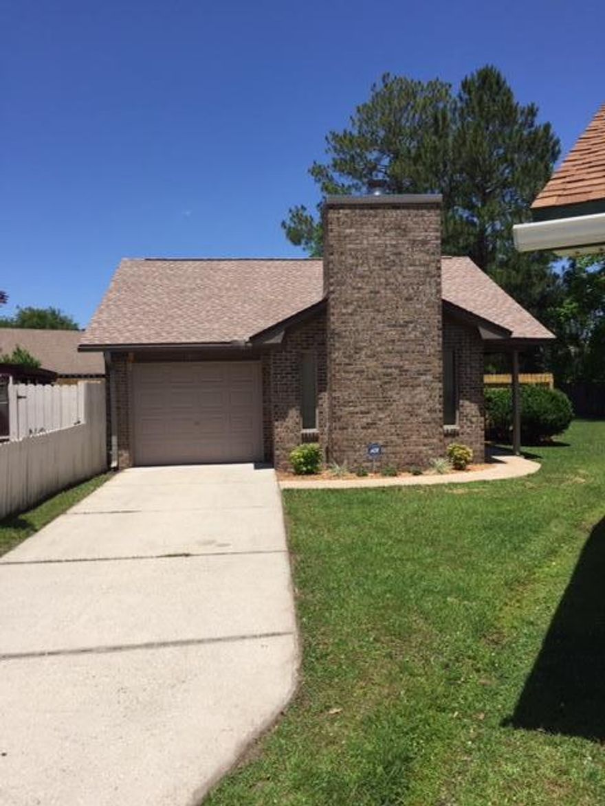 Very nice all brick home with one of the largest lots in the neighborhood. Very well maintained. Interior and exterior a/c replaced less than 2 years ago. New architectural roof installed this year and has a 50 year warranty. Exterior wood trim painted this year. New 40 gallon hot water heater installed less than 2 years ago. New carpet and vinyl flooring installed this year. New stove and range hood. Refrigerator only 4 years. Dishwasher is less than 3 years. New toilets installed this year. Interior painted as well this year. Some windows and a patio door replaced this year. I have a binder with a Wind Mitigation, Termite Contract, and all receipts and documentation. This home is like new.