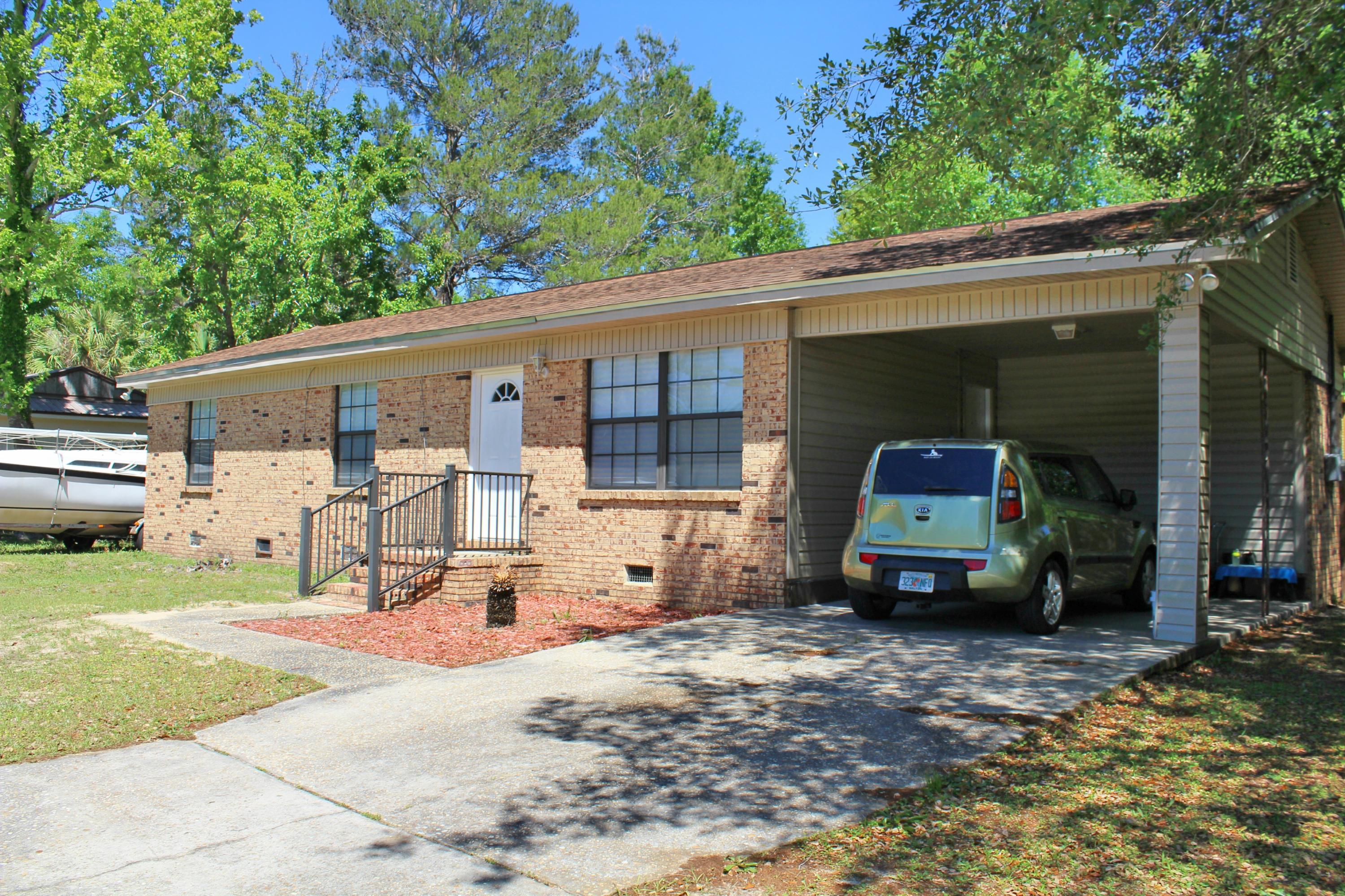 Seller will pay $3000 in Buyer's Closing Costs with FULL PRICE OFFER! Cozy three bedroom, one and half bath, one story brick home located conveniently to everything that DeFuniak Springs has to offer! Home has had several updates which include the kitchen and gorgeous wide plank laminate floors. The kitchen features plenty of cabinets, granite counter tops and breakfast bar and is attached to a spacious dining area.This home was made for outdoor entertaining with a 12x16 covered deck, fenced backyard and brand new outdoor shower.