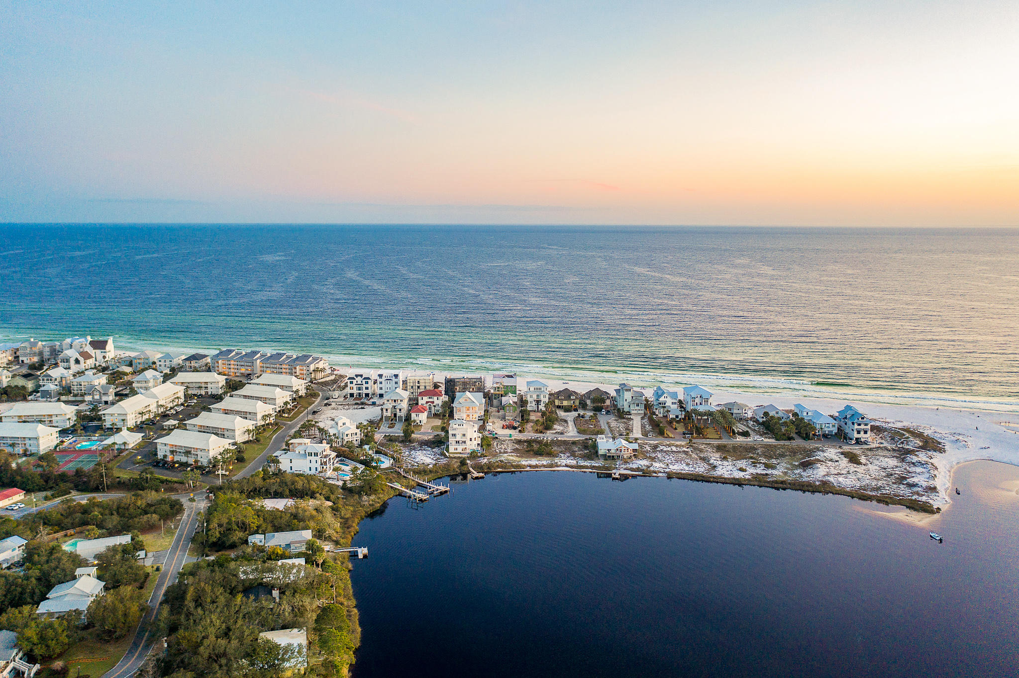 Stunning views of the Gulf of Mexico and Eastern Lake combined with astonishing architecture exemplify this incredible Seagrove property. Ideally located within the heart of Seagrove Beach along sought-after San Roy Road, this estate offers outstanding access to enjoy all 30A offers including the sugar white sands, emerald waters, world-class fishing, first-rate dining and luxury shopping. This exceptionally designed better than new luxury home offers multiple living spaces, six bedrooms, six full bathrooms, one half bathroom, a private garage, ample additional parking, a private pool and an unprecedented outdoor living space. The homesite offers additional space for the future construction of a separate carriage house and guest quarters.