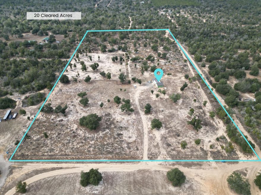 Excellent investment opportunity! This 20-acre cleared and functional parcel is located approximately 45 minutes north of Panama City, positioned directly across from Deep Springs Park. With road frontage on three sides, the property offers tremendous flexibility for a variety of uses such as a private homestead, recreational retreat, campground, multi-family development, or the addition of multiple homes or cabins.The property features a partially completed 4-bedroom, 1.5-bath residence with approximately 2,500 square feet of living space. The home is in the final phase of construction and already includes modern tile flooring throughout, a stylish contemporary kitchen, and a newly installed septic system. Remaining work is minimal and includes finishing sections of the front and rear porch roofs, fascia, exterior siding, and installation of one toilet. The property is being sold AS IS.

The land is well-equipped with four deep water wells, making it well suited for agricultural use. The property currently supports livestock such as cows and horses, along with an established vegetable garden. With no HOA, no known restrictions, and a recent survey available, this property offers a rare blend of space, infrastructure, and development potential--an excellent option for cash buyers seeking land with versatility and long-term value.

All information provided is deemed reliable but is not guaranteed and should be independently verified by the buyer.