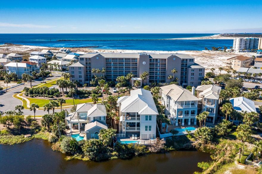 Wonderful 2 Bd/2 Ba condo unit on Holiday Isle with gorgeous unobstructed views of the East Pass & the Gulf. Living areas and primary bedroom both open onto the balcony where you can soak up the incredible views. Both sliding doors to the balcony were replaced 3 years ago. Kitchen updates prior to that include a built-in Sub Zero refrigerator, granite countertops. Ready for your updates/ decorator touches to convert this to an amazing vacation rental. Unit is on the 1st floor above the parking garage - very few steps to the front door, but beautiful elevated westly views - gorgeous sunsets. Magnolia House is a unique condo, located within Destin Pointe, gated island community featuring 3 pools, 24 hr security AND over 3,000 feet of beach, making a great vacation rental or call it home!