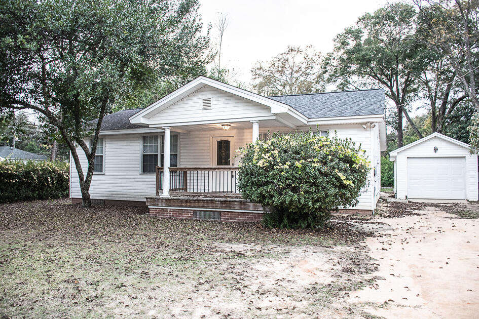 Available March 7th, charming and recently renovated older home located in the heart of Crestview. 4/2 floor plan features new flooring, newer paint, fixtures, exposed brick in the kitchen, kitchen island and much more. Shelving in the hallway perfect for collectibles, books, and framed pictures. Laminate barn wood flooring throughout the home with neutral paint. Natural light in the home. Large living room, dining area breakfast bar and spacious. Detached garage and laundry. Huge interior lot is magnificent and perfect for large gatherings. No inside smoking or vaping. Pets will be allowed with owner approval and $400 non-refundable pet fee. Affordable and convenient. Partially fenced yard.  A great space.