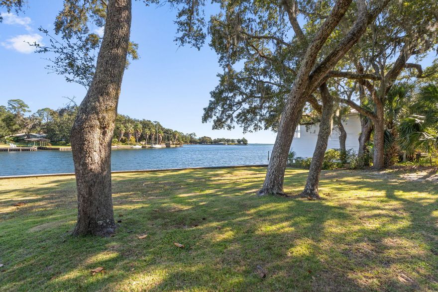 Rare opportunity: this 4,029 sq ft single-story residence claims 120 feet of waterfront on 0.8 acres--first time publicly offered since its original construction in 1960.The property delivers what waterfront buyers seek: direct bay access via private dock with boat lift, expansive deck and patio spaces designed for water-watching, and the kind of generous single-level floor plan that's increasingly difficult to find at this scale. 3-bedrooms, 3-baths, including a substantial primary en suite. The 22x45' garage features 22 feet of built-in cabinets and workspace, accessed via a circular driveway.The 1960 stucco-brick construction reflects the architectural confidence of its era--clean lines, thoughtful orientation to capture water views, and the kind of indoor-outdoor flow that defined mid-century living. Recent roof replacement (2022).
Lake Clyde provides protected waters off Choctawhatchee Bay with convenient access to Destin Pass and the Gulf.
This is a foundation property solid bones, prime location, ready for a buyer with vision to honor its heritage while bringing it into the next chapter. The 0.8-acre parcel and 120-foot water frontage create possibilities that don't come along often in Shalimar.
Showings by appointment.
