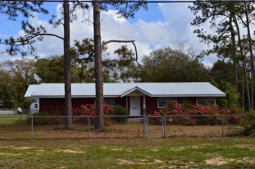 Great bones, great location and a great lot!  Only two blocks off of the lake-yard in historic Defuniak Springs, Florida.  Home features:  Brick construction - metal roof - 2 large bedrooms and 2 full baths - eat-in kitchen just off of the family room - formal living room.  Bedrooms are very roomy with plenty of closet and storage space.  Great workshop/yard building with power.  All of this on nearly 1/2 acre in the heart of Defuniak Springs and so close to the lake!  Make your appointment today!