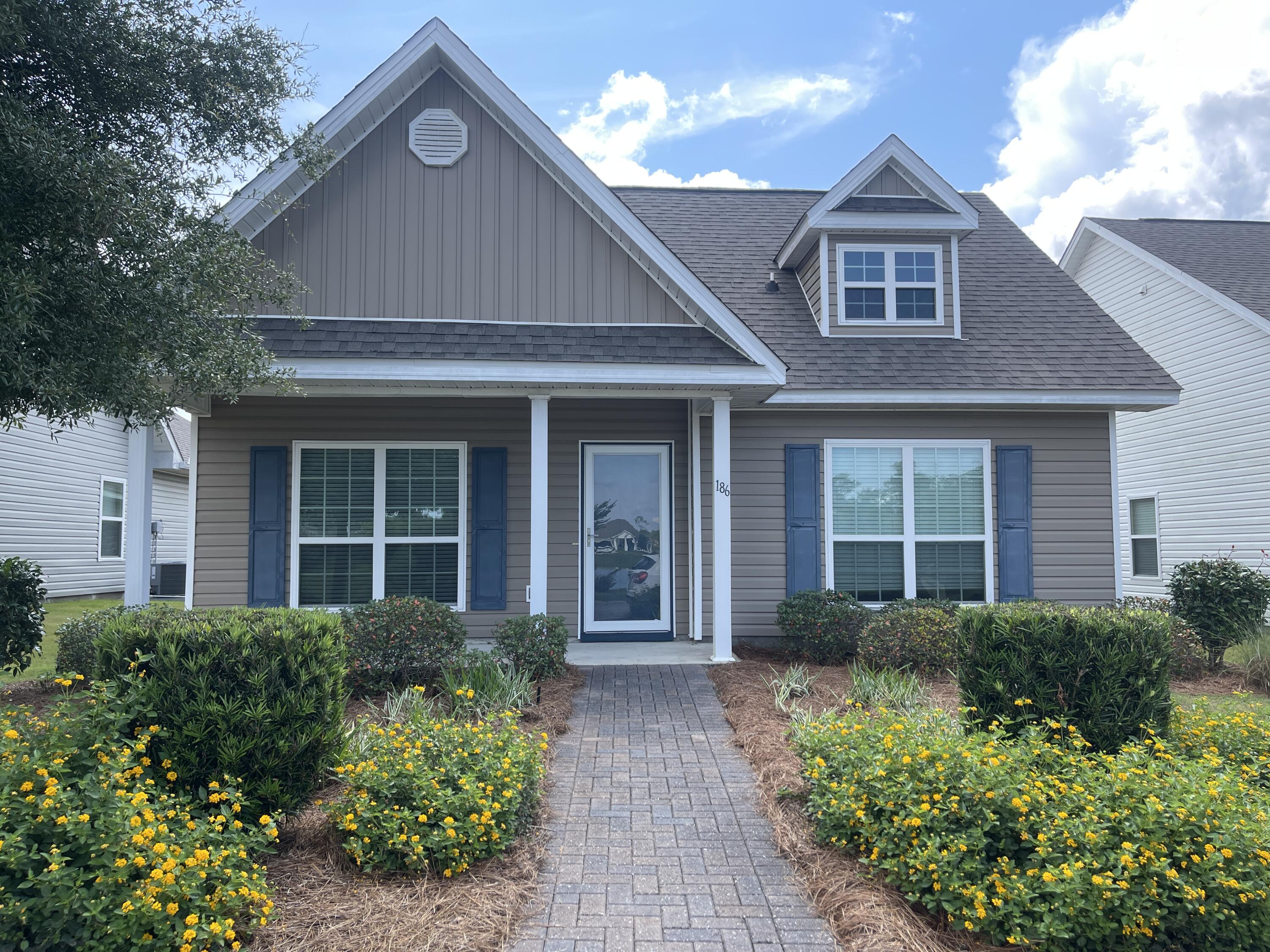 Charming 3-bedroom, 2-bath home with a picturesque water view overlooking one of the serene ponds in the beautiful Hammock Bay community. This home offers over 1,700 sqft of living space and features an open floor plan, a 2-car garage, and a laundry room. The covered front porch adds to its curb appeal, while the spacious living room boasts tray ceilings. The eat-in kitchen is equipped with ample cabinet and counter space, an island, and a pantry.The primary bedroom includes an en suite bathroom with dual vanities, a large walk-in closet, a walk-in shower, a separate linen closet, and a toilet room. The two additional bedrooms are generously sized and share a full guest bath.This community is packed with top-notch amenities, such as multiple resort-quality pools, a dog park, walking trails, a fitness center, a clubhouse, tennis and basketball courts, a General Store, playgrounds, a Bay-front pavilion and dock, RV/Boat storage (for an additional fee), and more!
Pets are considered on a case-by-case basis with prior owner approval and a non-refundable pet fee. No smoking is allowed, including vaping. HOA fees, lawn care, and cable are all included!