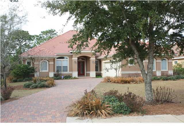 Absolutely gorgeous four bedroom, four bath custom home overlooking the lake and nature preserve in desirable Regatta Bay! Situated on a quiet cul-de-sac, this home is nearly new, just two years old and very lightly lived in! Well thought out floor plan for true Florida living, with a very open floor plan featuring a large, welcoming entry foyer, formal dining area to the right of the foyer, large great room, kitchen and breakfast area. Perfect for family and entertaining, with the living area opening onto a large tiled screened lanai. Split bedroom floor plan, with a luxurious master suite featuring a generously sized bedroom, his and hers walk-in closets, linen closet, bath with granite topped double vanity, large jetted tub, separate tile and glass walk-in shower, private water