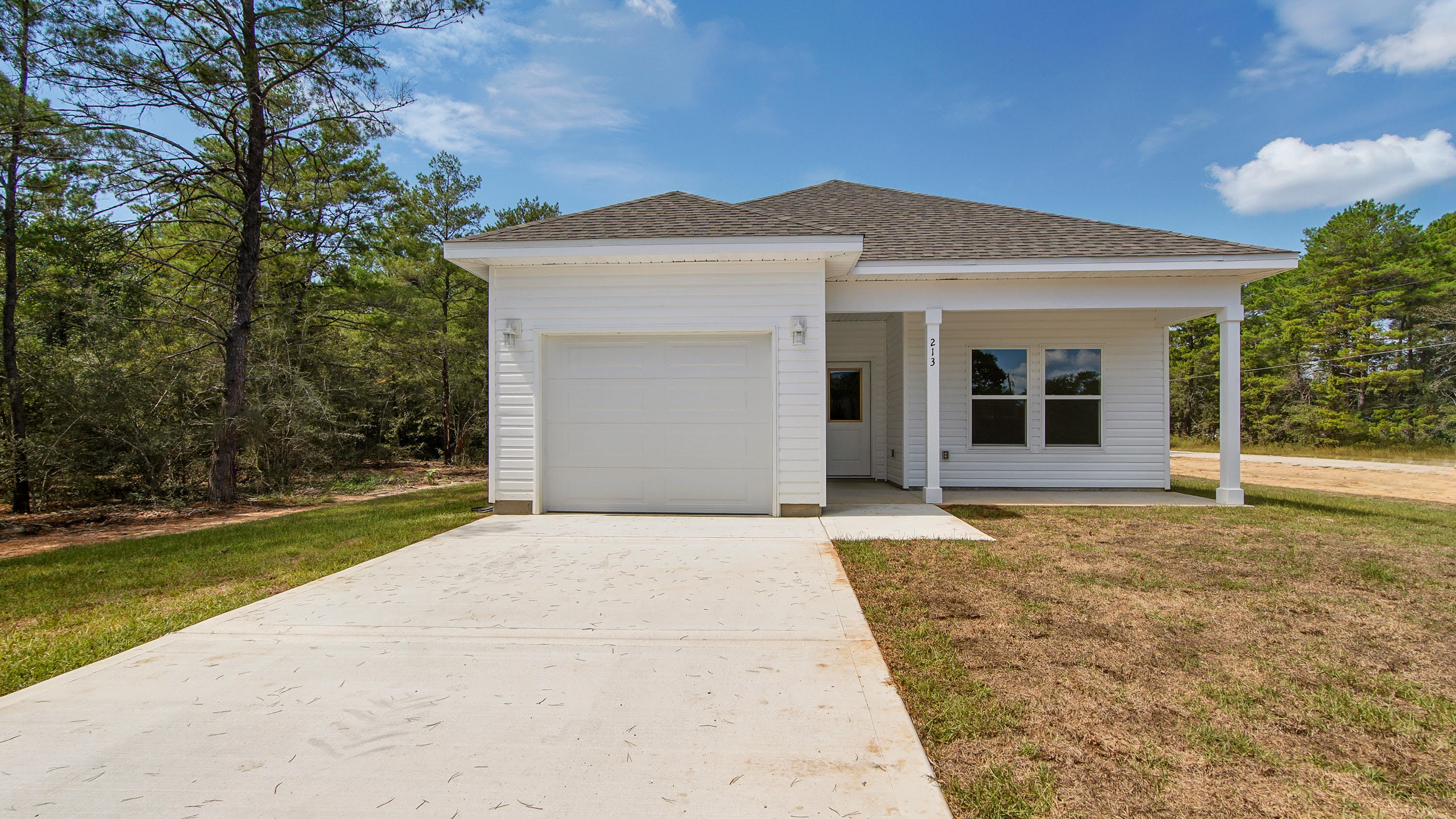 A beautifully crafted new construction home by Southern Home Solutions, an accomplished local builder known for quality craftsmanship and attention to detail. This home is ideally located in Flood Zone X (no required flood insurance), offering peace of mind and long-term savings. You'll love being just minutes from the future state park off Girl Scout Road, where nature, trails, and outdoor adventure await. Enjoy the security of a 1-year builder's warranty, quartz counter tops, wall to wall LVP flooring, ceiling fans in every room, 9 ft ceilings and located on a paved road. Annual insurance policy quoted at $615 per year. Situated only 28 miles from Eglin Air Force Base, this home is a great option for military personnel or those commuting to the base. Whether you're looking for your first home, a quiet retreat, or a place to settle in one of Florida's charming small towns, this property checks all of the boxes. Don't miss your chance to own a brand-new home in a growing area 11 miles from downtown Defuniak Springs restaurants, shops and attractions.