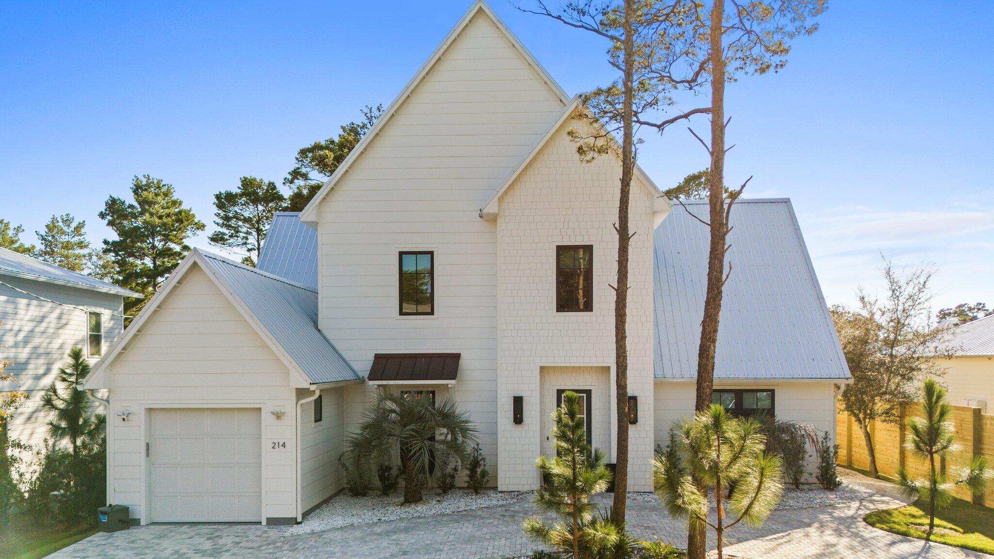 Nestled in the highly desirable Gulfview Heights community on the vibrant west end of 30A, 214 Woodland Drive is a masterpiece of modern coastal living. This 4-bedroom, 3.5-bathroom home boasts an exceptional design with luxurious features, making it an ideal choice for a primary residence, second home, or income-producing property. OFFERED FULLY FURNISHED OR NOT, DEPENDING ON THE BUYER'S PREFERENCE, this home ensures flexibility to suit your needs. Step inside and be greeted by 12-foot ceilings on the main level, soaring vaulted ceilings on the second floor, and a layout that blends elegance with functionality. Engineered hardwood floors, custom tile selections, granite countertops, and top-tier appliances are just a few of the high-end finishes that elevate this home to a class of its own.
The open-concept main level invites effortless entertaining, where the kitchen, dining area, and living room seamlessly connect. The chef-inspired kitchen, complete with a waterfall-edge island, a butler's pantry, and state-of-the-art appliances, serves as the heart of the home. Relax in front of the striking double-sided gas fireplace, or step out to the private back porch to unwind by the pristine pool. A thoughtfully designed sand trap room and oversized laundry room add convenience, while the first-floor master suite offers a tranquil retreat with a spa-like en-suite featuring custom cabinetry and a walk-in tiled shower. An additional bedroom or private office space completes the main level.
Upstairs, the home continues to impress. The spacious landing area features built-in bookshelves, a cozy window seat, and a charming bunk nook with three built-in beds, perfect for hosting additional guests. The bonus room, with its vaulted ceilings and abundant natural light, provides a versatile space for relaxation or play. Bedrooms three and four, along with the bonus room, open onto a private second-floor balcony, where stunning sunsets over the treetops provide the perfect end to every day.
Situated just moments from the iconic 30A beaches, world-class dining, boutique shopping, golf, and tennis, this home places you in the heart of one of the most sought-after coastal communities. Whether you're seeking serene relaxation or vibrant entertainment, 214 Woodland Drive offers the best of both worlds. Don't miss the opportunity to make this exquisite property your own.
Reach out to Kelsey Hampton for rental projections & cost-to-own figures (816.216.0282), kelsey.hampton@compass.com
Motivated Sellers!!