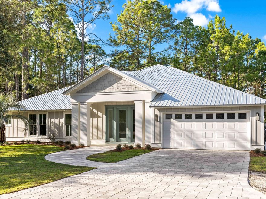 Tucked within the enchanting Sugarwood Beach community, this newly built coastal retreat offers over 3,200 square feet of refined, single-level living. Designed with effortless flow and coastal elegance in mind, it welcomes you with an open-concept layout where natural light, designer touches, and thoughtful finishes abound.The living room is warm and inviting, with a glowing fireplace and large windows that capture coastal breezes. Whether you're entertaining guests or savoring quiet moments, the space feels both sophisticated and serene.The kitchen is a true standout--anchored by a grand island, quartz countertops, mosaic tile, and top-tier Frigidaire professional appliances. It's a place made for gathering, cooking, and creating memories. With five spacious bedrooms and four well-appointed bathrooms, there's room for everyonewhether you're hosting weekend visitors or settling in full-time. Designer Heather Fuller's curated decor brings a polished, airy feel throughout.

Step outside to a covered patio with a second fireplacea rare luxury that turns outdoor living into a year-round experience. Just beyond, a shimmering pool with sundeck invites you to unwind and soak in the serenity of your private oasis.

Set on a large corner lot in a quiet cul-de-sac, this home is part of one of Seagrove's most beloved communitiesknown for its generous lot sizes, low HOA fees, and friendly neighborhood charm.

Whether you're seeking a full-time residence, vacation home, or smart investment, this Sugarwood Beach retreat blends comfort, design, and coastal living in one unforgettable package.