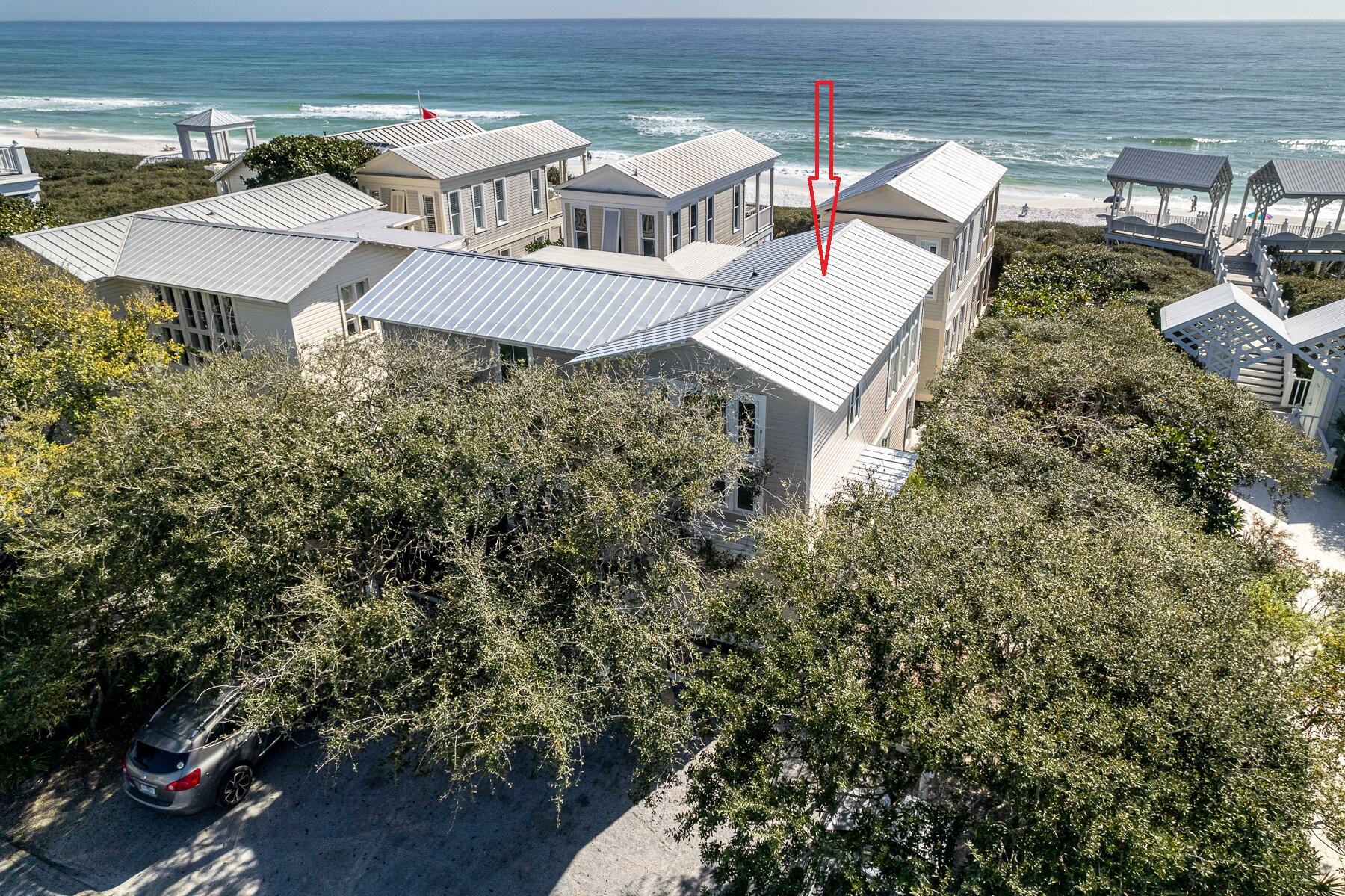 'MERILEE BY THE SEA' Located south of 30A and just steps to the East Ruskin Pavilion, this lovely two-story cottage boasts an exceptional location with terrific gulf views. With a beautiful master suite on the second level, you can wake up to the sound of waves lapping the shoreline and the sun sparkling off the turquoise waters. An adjoining porch creates a seamless connection between interior and exterior spaces, visually increasing the size of the adjacent living room and bedroom. Oversized windows allow for plenty of light, gorgeous gulf views, and spectacular sunsets! New quartzite countertops adorn the kitchen, including a newly designed breakfast bar and all stainless-steel appliances. The first level sports a second master bedroom and an en-suite bathroom with double vanities, and