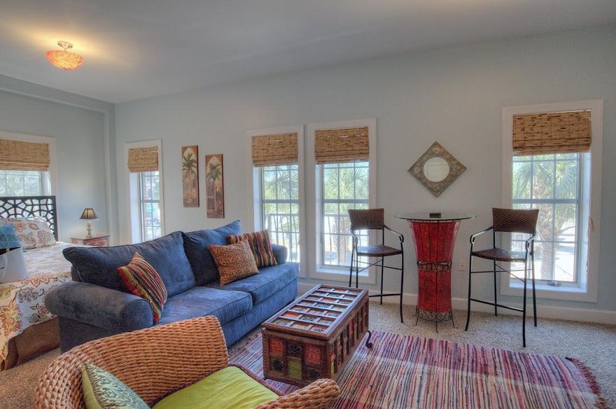 This generous size studio has it all! Abundant natural light pours into this end unit from six windows which overlook Peddler's Pavilion and the music fun and excitement of 30A. Freshly painted with new carpet and decorated in a chic world traveler motif this unit comfortably sleeps 4. Perfect as a romantic weekend retreat or investment property with rental projections exceeding $20,000. Being sold furnished and rental ready. This unit has a kitchenette with fridge and microwave perfect for breakfast, snacks and sunset wine and cheese. The Village has deeded beach access and a shuttle that delivers you to the beach. There is an onsite pool and access to the 12,000 square foot lagoon style pool in Seacrest. The Village is nestled between Rosemary Beach and Alys Beach.