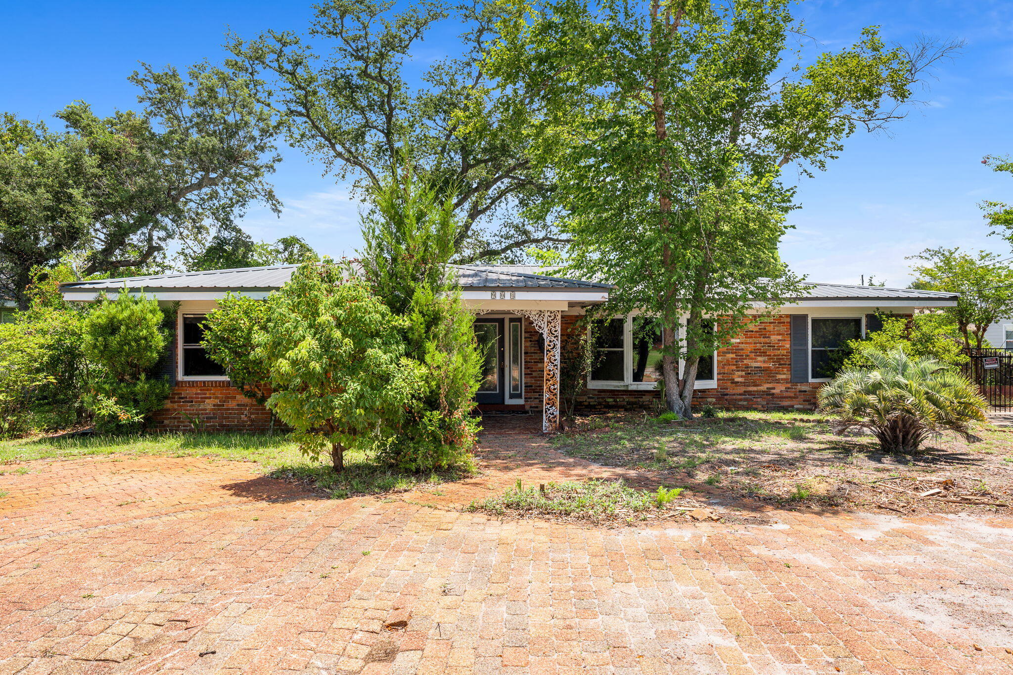 Don't miss out on this 4 BR 2 Bath home located in the Garden Club District near St. Andrew Bay. Formal living and dining room and large family room. Large wooded lot with a detached carport and storage/work area. Property has been priced strategically in AS-IS condition.