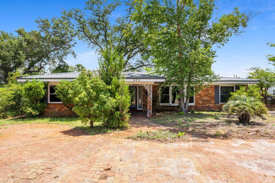 CURRENTLY UNDER CONTRACT, SELLER WILL CONSIDER BACKUP OFFERS' Don't miss out on this 4 BR 2 Bath home located in the Garden Club District near St. Andrew Bay. Formal living and dining room and large family room. Large wooded lot with a detached carport and storage/work area. Property has been priced strategically in AS-IS condition.