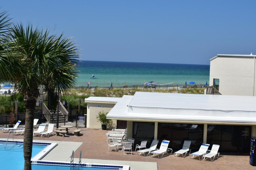 Enjoy awesome views of the Gulf of Mexico from this Sugar Beach condo! This is a 3BR/2BA, two-story unit that faces the beach and gulf and overlooks the pool and community room. The unit is being sold furnished and recent upgrades include bamboo flooring, Low-E3 windows (the ones facing the beach), newer AC unit, and since this was a model unit, it also has one of the largest kitchens. Sugar Beach is a gulf front complex with dedicated beach, large pool and community room, a pretty central pond filled with Koi and ducks, and the tennis courts and parking lot have been recently resurfaced. Great investment potential for this condo! All info is approx. and must be verified by Buyers if important.