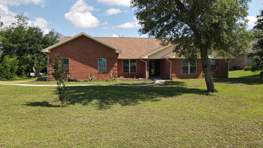 Embrace the allure of lakeside living in this stunning 2637 sqft retreat nestled along the shores of Deer Point Lake. Step into luxury across 4 bedrooms, 2.5 bathrooms, and a sprawling living space adorned with tile floors throughout. A grand foyer welcomes you, leading to a spacious living room boasting a cozy fireplace. Kitchen featuring granite countertops, stainless steel appliances, and a charming breakfast nook, just off the kitchen find the formal dining Primary suite, complete with a generous walk-in closet, ensuite bath featuring a double vanity and an oversized walkin shower. Dedicated office space, ideal for remote work or creative pursuits. Step outside to discover your own private sanctuary. The screened-in porch provides the perfect setting for dining or unwinding.