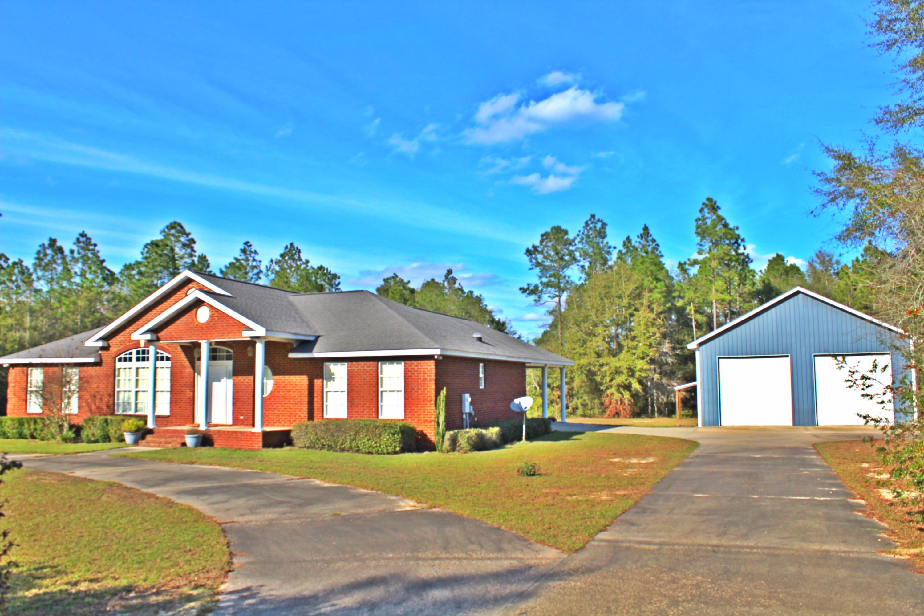 Don't miss out on this beautiful home on 2 acres. There are three bedrooms and two and a half bathrooms with over 2000 sq ft. This home features an open floor plan with hardwood flooring through out most of the home and tile flooring in the bathrooms and utility room. The open kitchen featuresCorian solid surface counter tops and custom cabinets. The master bedroom has a walk in closet and a large 6'X 6' walk in shower. The two additional bedrooms are split by a Jack and Jill bathroom. There is plenty of out door living space with a covered back porch and pergola covered patio. There is also an 35x50 (1750 sq ft) barn with electricity and water that features a custom painting booth and a home gym. Make an appointment for your private tour today!