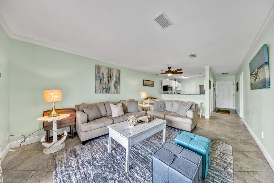 UNDER CONTRACT WITH 72 HOUR KICK OUT CLAUSE. 1ST FLOOR UNIT W/ GULF VIEWS!!  Located directly across the street from one of the most popular beach accesses on the Emerald Coast, beach lovers will be able to feel sand between their toes in less than a minute.  Beware, the aroma of freshly cooked seafood from the world famous Pompano Joe's may induce a chronic sensation of hunger.  Not to worry, the 5 mile walk/run/bike path is positioned directly in front of the unit.  The roomy patio offers plenty of space to enjoy a sunset or a family meal.  With over 800 sq ft, this 2 BR, 2 BA unit has a completely updated kitchen that includes STAINLESS STEEL APPLIANCES, NEW COUNTERTOPS and NEW CABINETS.Both Bathrooms boast NEW TILED SHOWERS and VANITIES.