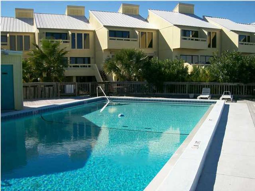 Renovated and ready for a new owner! Great waterfront community which has gated docks and boat slips. The views are terrific. Relax by the pool watch the sunset or sunrise if you prefer. This is vacant so you must come and see for yourself. Back on the market because buyer's financing was denied. Freddie Mac does not pay doc stamps on the deed. That must be a buyer's expense.