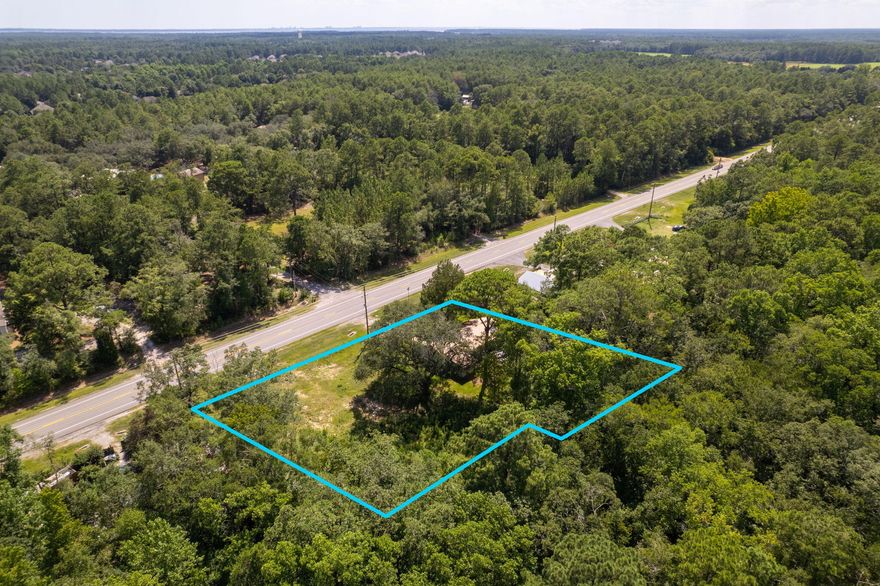 This .5 acre lot and the adjacent .54 acre lot to the east are being sold as one combined parcel. The two parcels combined provide for over 234' of frontage on the heavily trafficked Hwy 20