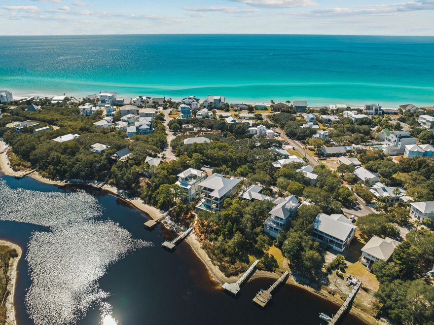 Just a block from the sugar-white sands of 30A, with deeded beach access, 157 Blue Lake Road is a breathtaking waterfront retreat situated on Big Redfish Lake. Developed and designed by KK30A Homes and masterfully constructed by renowned local builders Coastal Custom Builders, this extraordinary property offers sweeping lake views with glimpses of the Gulf, seamlessly blending coastal elegance with the tranquility of a lakeside escape. With direct lake access via a brand-new private dock, residents can enjoy swimming, kayaking, and paddle boarding straight from their backyard, with the unique opportunity to paddle directly from the home to the Gulf.

Spanning three levels, this home boasts over 6,400 square feet of thoughtfully designed heated and cooled living space, along with an additional 1,700 square feet of covered outdoor areas. Expansive porches and balconies create a harmonious indoor-outdoor living experience, while cleverly designed storage beneath the home ensures ample space for all your outdoor gear and recreational toys.

This impeccably designed residence features eight generously proportioned bedrooms, each with elegantly appointed en-suite bathrooms. Designed to embody the essence of a luxurious coastal lake house, the interiors reflect a soft, natural color palette and neutral tones, curated with high-end furnishings. Upon entering, guests are greeted by a spacious great room with an additional sitting area, a wet bar complete with a wine fridge and ice maker, and large sliding doors that lead to the expansive first-level outdoor living space and oversized private pool. This level also includes one of the home's two primary suites, offering direct access to the covered outdoor space, as well as a second guest bedroom for added convenience.

A grand staircase or private elevator leads to the heart of the home on the second level. This space features a soaring 12-foot ceiling great room, anchored by an elegant electric fireplaceperfect for cool coastal evenings. The chef's kitchen is a masterpiece, featuring a large Sub-Zero fridge and freezer, a Wolf range, a custom vent hood, and exquisite custom cabinetry. Dual marble-clad islands provide ample prep and gathering space, complemented by an adjacent dining area. Towering 10-foot sliding doors offer uninterrupted views of Big Redfish Lake and its majestic pine trees. An outdoor summer kitchen, overlooking the lake with glimpses of the Gulf, provides a perfect setting for al fresco dining. Two additional guest bedrooms with balcony access complete this level.

The third level unveils yet another inviting living space, featuring a wet bar with a fridge and ice maker. This level hosts four additional bedrooms, including the primary suite, which offers direct access to a spacious outdoor living area. Here, you can truly live in the trees, surrounded by lush native pines with picturesque views of Redfish Lake and the Gulf. Two additional well-appointed guest suites with king beds and a bunk room outfitted with full-over-full bunk beds provide ample accommodations for family and guests. This home is move-in ready, complete with TVs throughout, multi-zone Sonos surround sound, and security cameras.

With its tranquil location, refined finishes, and exceptional design, this home is ideal as a primary residence or a second home. However, given its prime location near the beach, shopping, and dining, its ability to accommodate up to 26 guests, and parking for eight vehiclesincluding a fully finished garageit also presents an incredible investment opportunity as a high-performing vacation rental. Moments away from multiple public beach access points, the home is in close proximity to popular local restaurants such as Redfish Taco, Goatfeathers, Local Catch, and Basmati's, as well as shopping and entertainment at Gulf Place.

A rare and remarkable find in Blue Mountain Beach, 157 Blue Lake Road embodies the best of luxury waterfront living, offering an unparalleled blend of serenity, nature, and convenience.