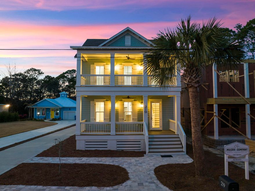 Experience coastal living expertly curated for a life of everyday indulgence. This new construction, timeless gulf-side estate offers a four-bedroom primary home, one-bedroom carriage home atop the two-car garage. As you enter the front door to the foyer, you will find Board and Batten walls and a stunning White Oak Stairway with V-groove (shiplap) walls illuminated by beautiful Chandelier and Wall Sconces. The adjoining family room also features Board and Batten walls as well as exposed ceiling beams. The expansive 13x13 dining room, adorned with an elegant hanging fixture, would generously accommodate a grand table and chairs, creating a lavish space for entertaining.