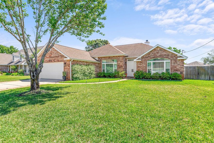 Welcome Home to this stunning 4 bedroom, 2 bath property just a few miles from Hurlburt Field. This thoughtfully designed space is open and has a split floor plan. The kitchen features custom, solid wood maple cabinets, a tiled backsplash and Silestone countertops! There is a kitchen island, a breakfast bar, stainless steel appliances, a built-in microwave and a French Door Refrigerator. Additional features include pendant and recessed lighting and an eat-in area that overlooks the large, manicured backyard! Living room features built-in book cases and a custom tiled fireplace.