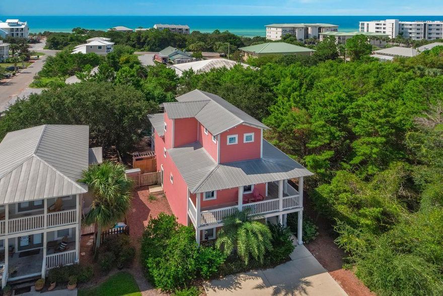 Welcome to Elizabeach! You won't want to miss this charming Old Florida home located in the heart of Seagrove beach. This stunning three story abode offers gulf views, a heated private pool and can accommodate up to 14 beach goers! This really is a private beach oasis, featuring a lovely lagoon shaped pool, private fenced in backyard, paver stone patio, with adirondack seating, fire pit, smoker grill and plenty of seating to relax and soak in the Seagrove beauty.  This accommodating five-bedroom home includes two Master Suites with private luxury baths, and one of them is on the third floor with an open Observation Deck. This design plan with bedrooms on all three levels works well for two sets of families. The tropically landscaped home has a gracious look and feel thanks to a wrap-around