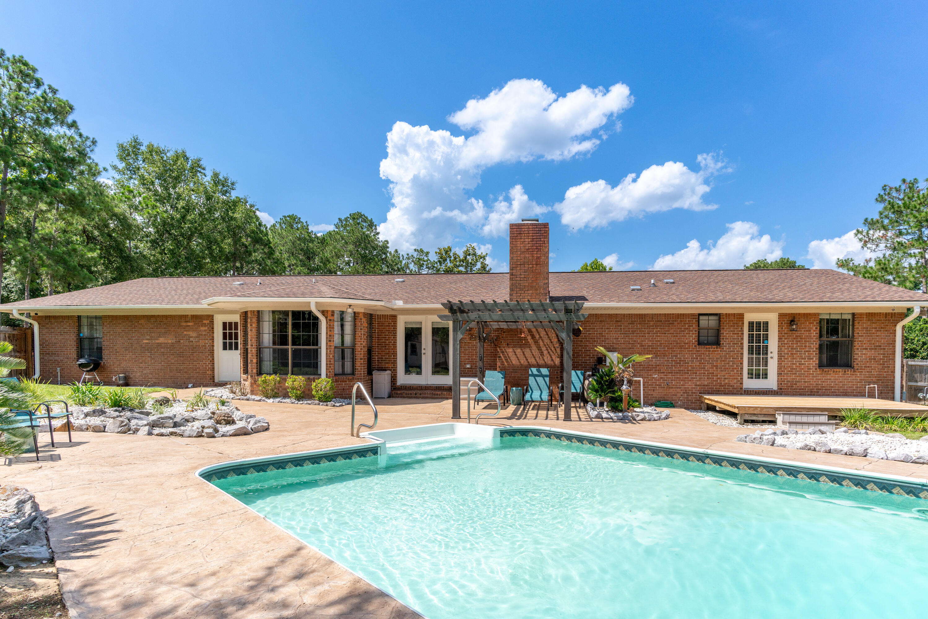 Enjoy early mornings on the covered front porch! Pride in owner shows with recent upgrades to the property to include HVAC 2016, roof 2018, bathrooms remodeled in 2021, gas water heater 2022, and a whole house gas Generac in 2022, providing peace of mind during power outages. One of the highlights of this property is the inground pool, perfect for cooling off. Breakfast nook that looks out to the back yard & pool area, kitchen offers abundant cabinet storage. Bright and airy living room and separate dining room feature large windows. The master bedroom offers his and her closets with built in drawers, boasting an en-suite bathroom that has been updated with a walk-in shower equipped with dual shower heads. Long drive way offers plenty of driveway space. Truly a must see.