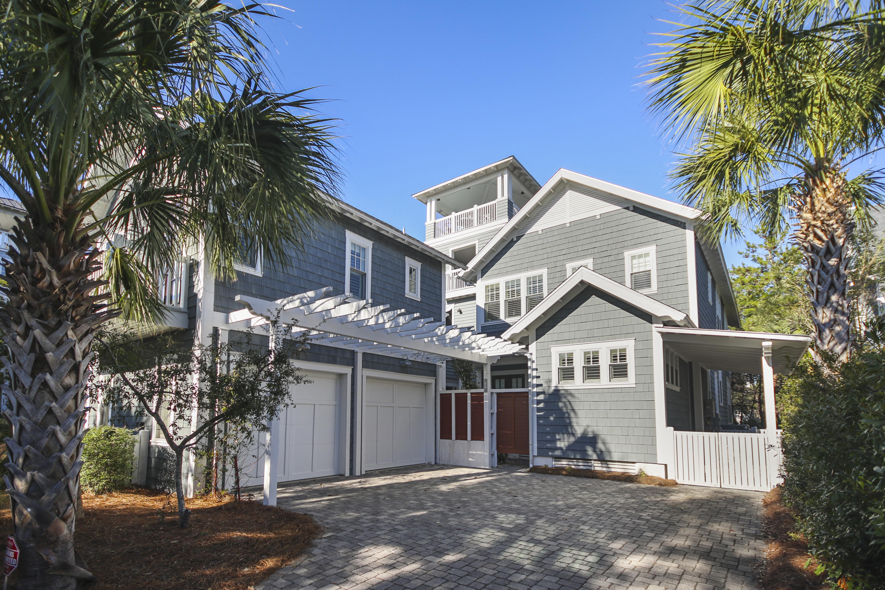 Enjoy the expansive, private beaches and coastal dune walkovers that only life at WaterSound Beach offers, in this spectacular custom home. From the moment you walk inside, you'll know your home. The residence exceeds all expectations and is characterized by intricate, detailed craftsmanship, including stained natural wood, crafted into extraordinary moldings; and unique ceiling accents in several rooms.The home is introduced via an impressive concept living area that opens to the chef inspired gourmet kitchen with a remarkable oven hood over the 6-burner gas stove and suite of Thermador professional appliances. The oversized center island with a farmhouse sink includes a stunning natural countertop. The great room is further enhanced by the