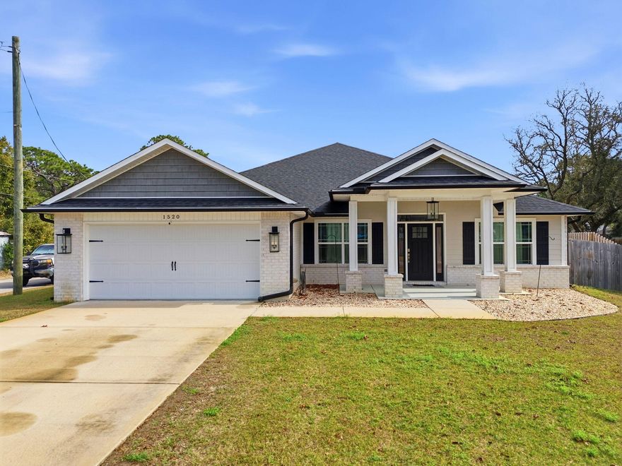 OPEN HOUSE - Saturday 1/17 from 11am-2pm. Beautifully maintained 4-bedroom PLUS office/bonus room, 3 full baths, offering 2,254 square feet of thoughtfully designed living space--NO HOA! Built in 2022 and perfectly located in the desirable Tiger Point area of Gulf Breeze, just minutes from Navarre and Pensacola Beaches. This all-brick and Hardie-plank siding home sits on a spacious .43-acre corner lot with a wraparound privacy fence, offering plenty of room to add a pool. Inside, you'll find luxury vinyl plank flooring in the main living areas, crown molding, and stylish black farmhouse lighting throughout. The open-concept kitchen features granite countertops, stainless steel appliances, a farmhouse sink, under-cabinet lighting, and a large island with bar seating perfect for entertaining. The split floor plan includes three guest bedrooms, all with walk-in closets, while the office/bonus room offers flexibility for a home office, playroom, or additional living space. The primary suite is complemented by granite countertops in the ensuite bath, matching the granite found throughout all bathrooms. French doors lead to a covered back patio overlooking the expansive backyard. Additional features include high-end impact-rated windows with hurricane shutters, a sprinkler system on a well, gutters, security system, attic storage, and more. Spacious, stylish, and ideally located near beaches, shopping, and dining this home truly checks all the boxes. Schedule your private showing today!