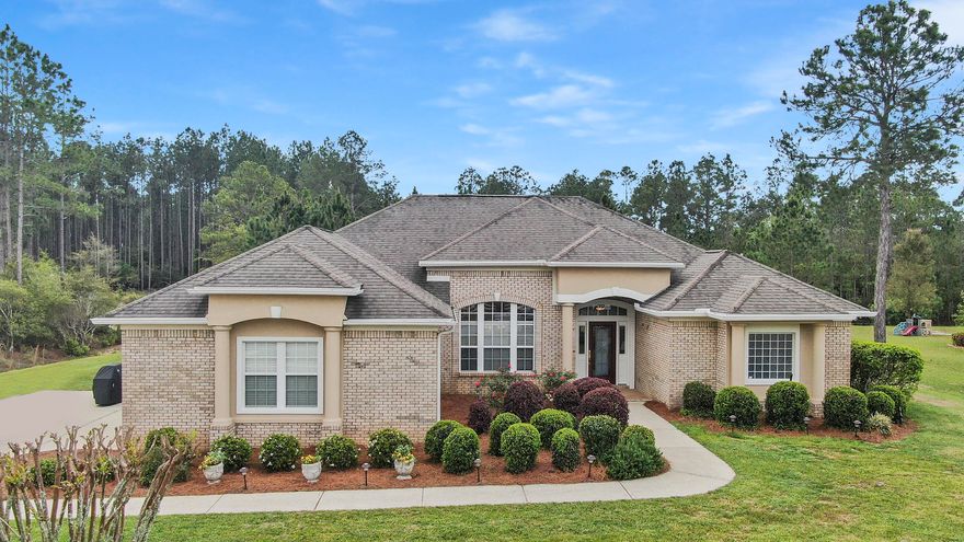 This phenomenal, well maintained, executive style home in Windswept Estates offers an abundance of space and serenity. Situated on .65 acre, enjoy the privacy from your 260 sq ft screened-in back porch.  This 4 bedroom, 3 bath home boasts two separate living areas, a formal dining room, a large open kitchen with new Kenmore Elite appliances, a split floorplan, a Jack-n-Jill bathroom, plus an additional third full bathroom, and a fenced-in back yard with plenty of space for a swimming pool.  With over 2,500 sq ft, this home has recently been repainted, offers all new appliances including a washer/dryer, new irrigation pump and tank, new garage door rollers and openers, has had regular HVAC maintenance, and transferrable home warranty coverage.