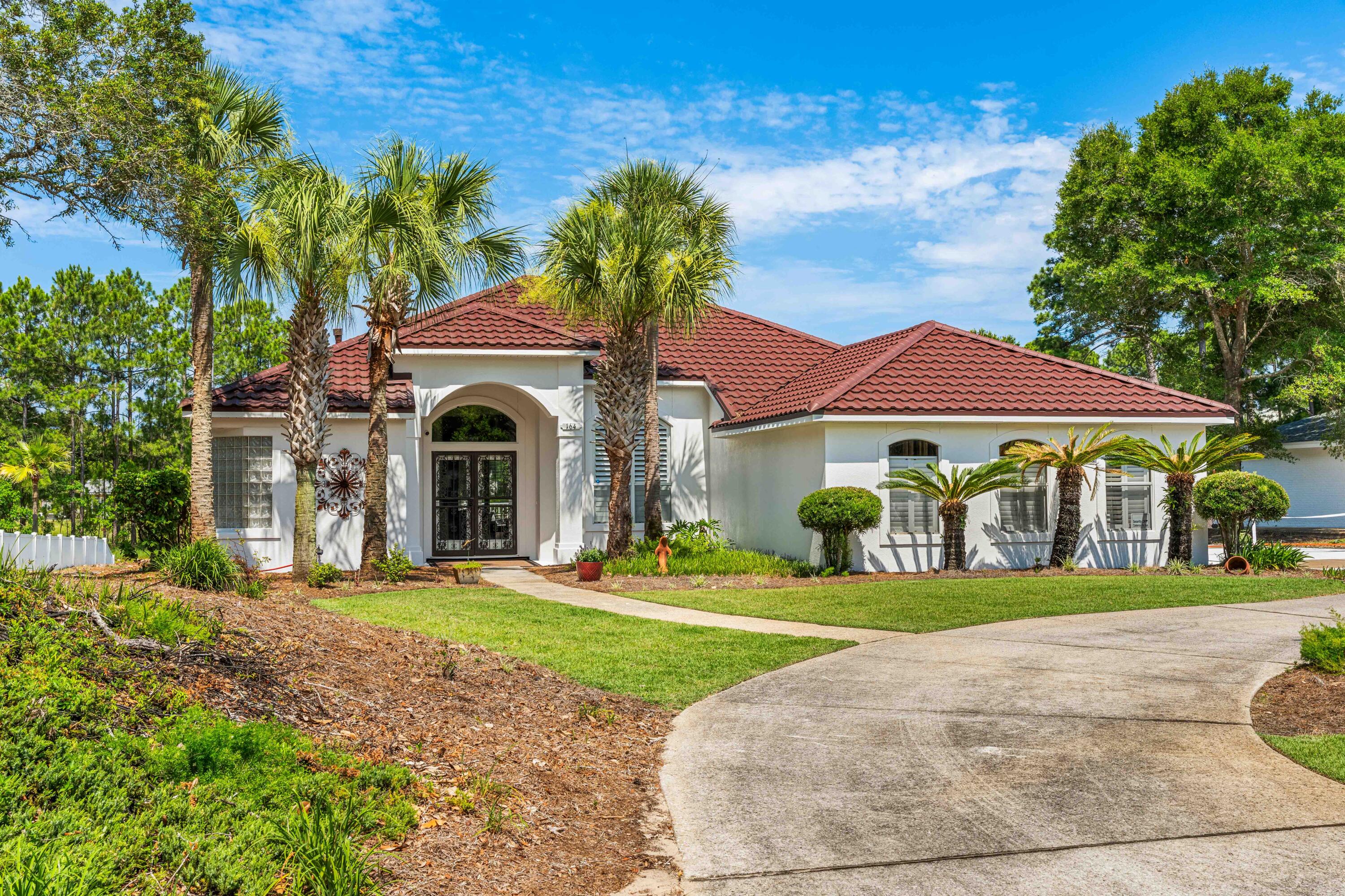 This beautiful, fully furnished, 4-bedroom home is nestled in the coveted Gulf Pines community. With an inviting open concept floor plan, this residence is designed for effortless entertaining and seamless transitions between its well-appointed spaces. Step outside to your own private dock, where the tranquil lake beckons, or unwind in the expansive screened-in porch. Whether you seek a primary residence, a vacation retreat, or an investment opportunity, this property presents an exceptional chance to own a slice of beachside paradise. A pool can be added to the lake side of this home, inquire about the plans. Gulf Pines owners and guests get to enjoy 1300 feet of private gated deeded beach between Sandestin and Hidden Dunes with ample parking for golf carts and cars. Two car garage is partially converted to an additional two more bedrooms and bath. 