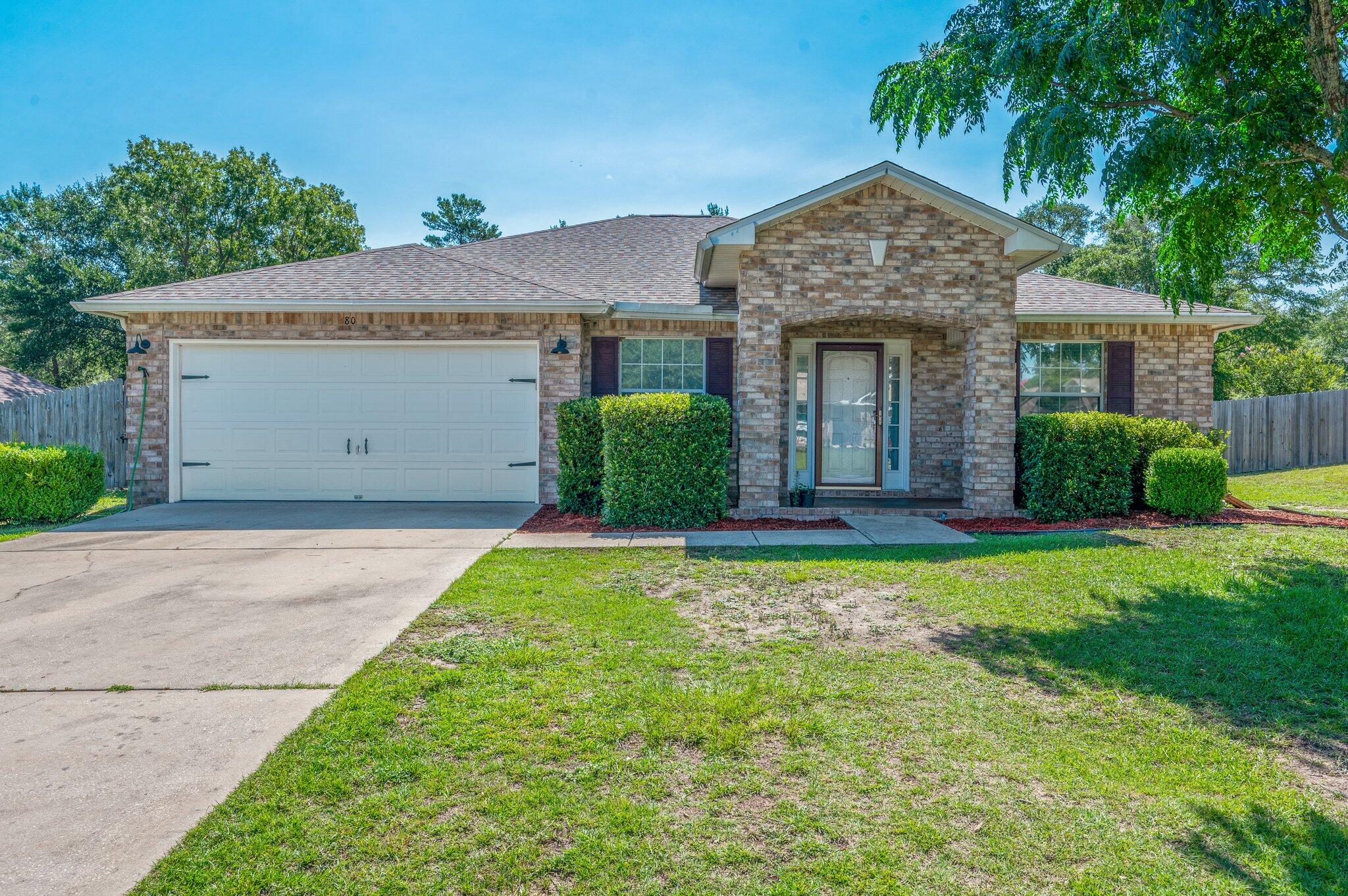 This brick home features 4 bedrooms & 3 bathrooms with an open floor plan. Step onto the paved brick patio & into a welcoming dining area, complete with a dedicated office near. The kitchen is designed for both function and style, offering granite countertops, a gas stove, & a spacious pantry. The master suite includes a walk-in closet, double sinks, a relaxing soaking tub, & a separate shower. The laundry room leads directly into the garage, which has built-ins & plenty of storage. Out back, enjoy the screened porch that overlooks a fully fenced backyard, with the added convenience of a full bath that opens right onto the porch. Nestled on a quarter-acre lot in the desirable Magnolia Lake Estates neighborhood, with a new roof & new flooring, this home is ready for the next chapter.