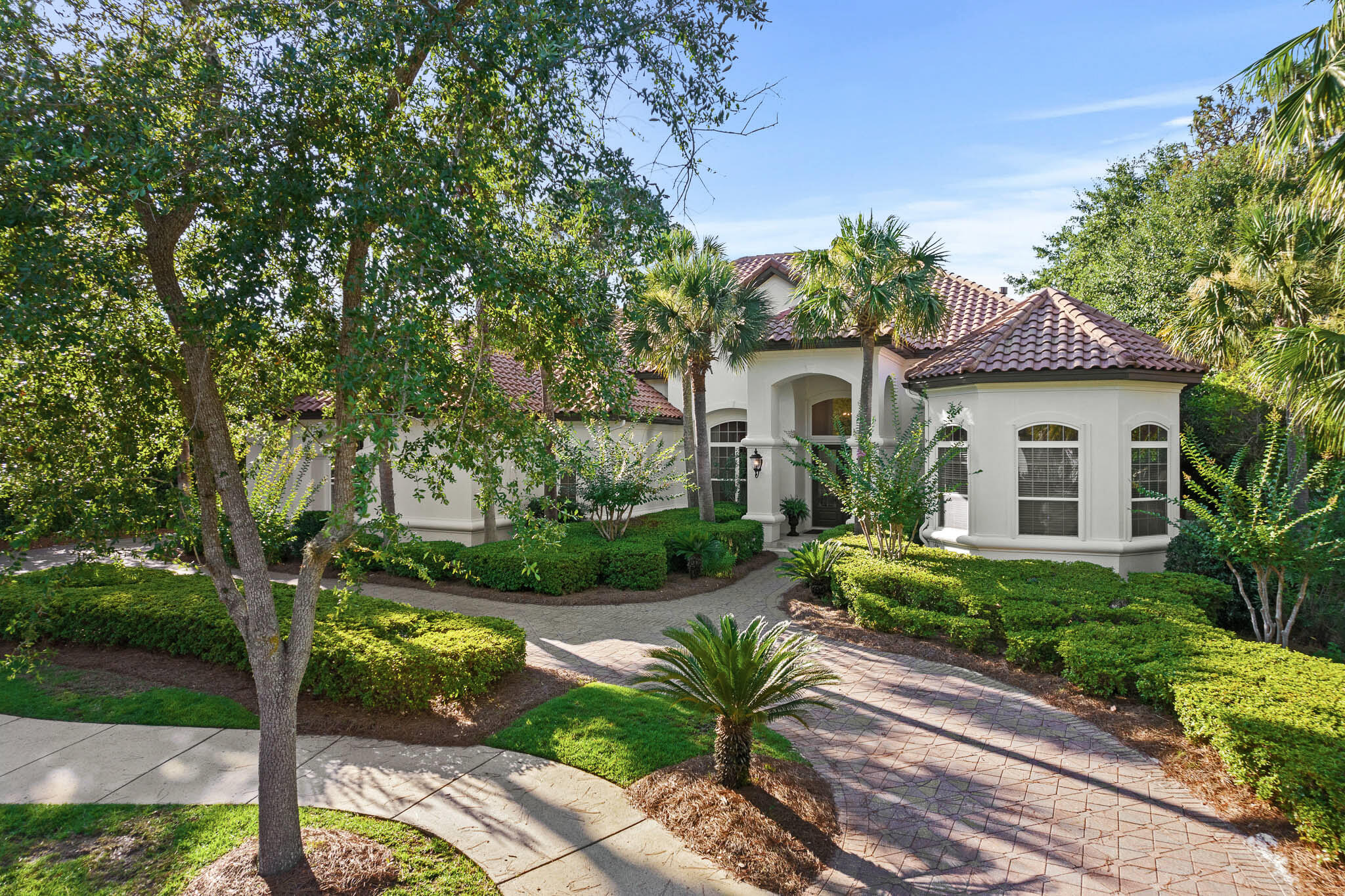 Overlooking the 5th fairway of Burnt Pine beyond the largest lake at the Rees Jones course is this custom built, fully renovated Boswell home. With an open floor plan suited for today's lifestyle, this 4,981 square foot home offers thoughtfully designed and furnished spaces that flow easily for entertaining and an oversized three car garage.  The lakefront location and outdoor swimming pool provide peaceful views through floor to ceiling windows. A full renovation was completed in 2020 reflecting timeless details and finishes in each room.  The main level features a formal living entrance, formal dining room, custom Wolf-Sub Zero kitchen, spacious master bedroom suite, two guest bedroom suites, laundry room, mud room, and access to the covered outdoor living area and pool with screened