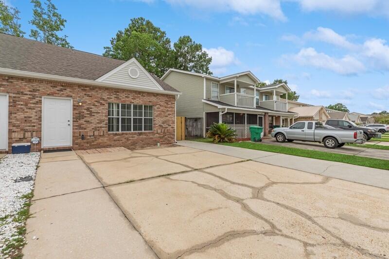 This affordable 3 BR/2.5 BA is located between Hurlburt Field & Eglin Air Force base near shopping, beach, college & schools. New roof was put on in 2022. A new AC and Rheem water heater were installed in 2017. Large great room with vaulted ceiling with 2 ceiling fans. Galley-style kitchen with breakfast bar, pantry, smooth top stove,, plenty of cabinets & double black stainless-steel sink with, pull-out faucet. The primary bedroom is downstairs. Beautiful wood-look laminate floors throughout the home. No carpet! There is a half bathroom downstairs. there are two bedrooms upstairs with a Jack and Jill bathroom. One of the bedrooms overlooks the great room. Enjoy sitting outside in your private back yard with two yard storage areas. Don't miss this home!