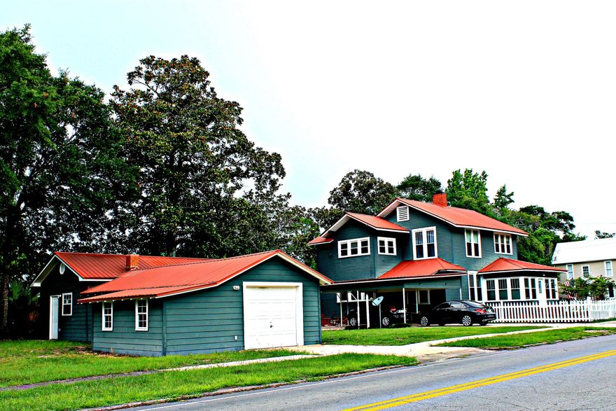 This charming home is just what you have been waiting for! It is located in the Historic District of DeFuniak Springs and 1 block from Lake DeFuniak. This home has been completely renovated and professionally done. The kitchen is what all cook's dream of! Double wall ovens, smooth surface cook-top with stainless steel range hood, farmhouse sink, large island with built-in bookcase, ceasar stone quartz counter tops, stainless steel appliances, large pantry. The dining room is perfect for entertaining. Spacious master bedroom with en suite master bath that features a claw foot tub with separate shower and double sink vanity. The washer and dryer are also located off the master bath. The detached garage has plenty of room for storage and a work shop. It is wired for 220 voltage, has running w
