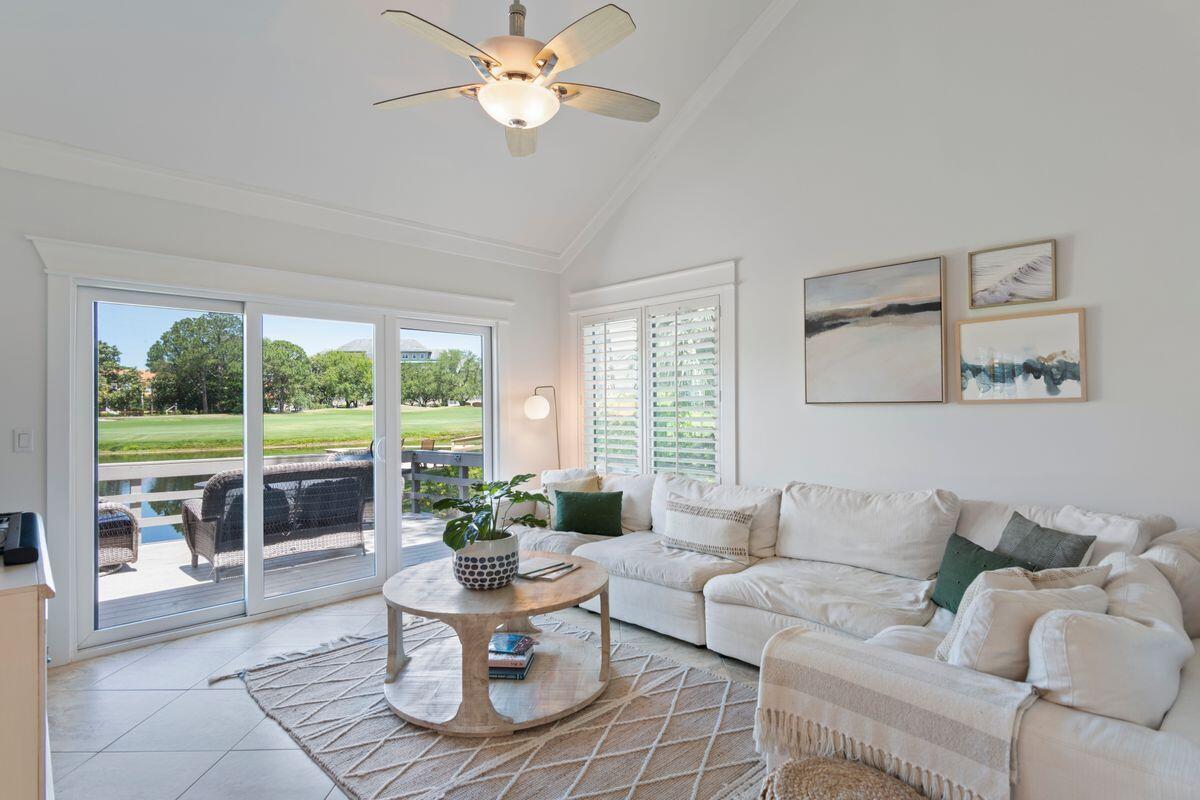Property is under contract but seller is taking backup offers. Located behind the gates of Sandestin Resort, this two story townhome goes beyond expectations with breathtaking lakefront, golf course and bay views. Nestled among the pines, this tastefully updated home comes with impressive rental history and is move-in ready, right down to the newly appointed furniture. Upon entry, you are instantly greeted with tranquil views that extend into the light-filled dining room and living room, which features vaulted ceilings, fresh, modern decor, and new windows and doors (2019) throughout. The master bedroom suite and ensuite is conveniently located on the first floor while stairs lead up to two equally attractive bedrooms that share a spacious bathroom. A well planned kitchen completes the