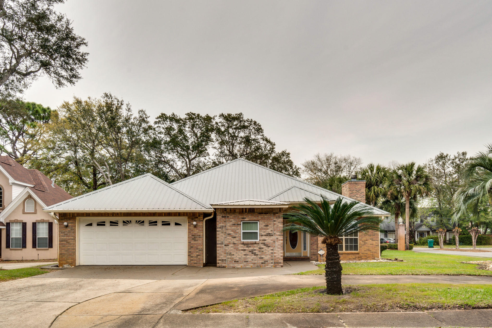 Gorgeous Mediterranean style home located on a corner lot in the desirable Palm Shores Community of Shalimar. Featuring an over-sized driveway & manicured lawn. Enjoy a short walk to your deeded water access & dock. You will love the ''Man Cave'' off the front of the house with various uses (not included in sft), spacious kitchen featuring granite countertops, stainless appliances and tons of cabinets. The formal dining room & master bed have trayed ceilings. You will find a granite double vanity, separate shower & jetted tub in the master suite. This home has 2 living rooms for lounging, entertaining and more. Home has quick access to all things Shalimar, 5 minutes to the beach, 5 minutes to Eglin AFB and 10 min to Hurlburt Field. Call for more details or schedule your showing today!