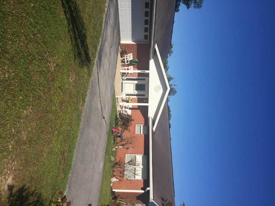 Beautiful brick home situated on 3 acres overlooking a large pond. The brick home has 2 large bedrooms and 2.5 large bathrooms. The living room and dining area are very open and could be put back to a third bedroom if needed. This home has tile flooring and lots of large windows allowing plenty of natural light into the home. There is a small screened back porch overlooking a beautiful private pond. There is also a large garage with an additional kitchen for parties and gatherings. The home also has a large workshop and storage building. The yard is maintained to the pond and has a small area fenced for the animals. The private road is paved to the home. The home has generator that automatically cuts on if electric goes out. Great place!!!!!!
