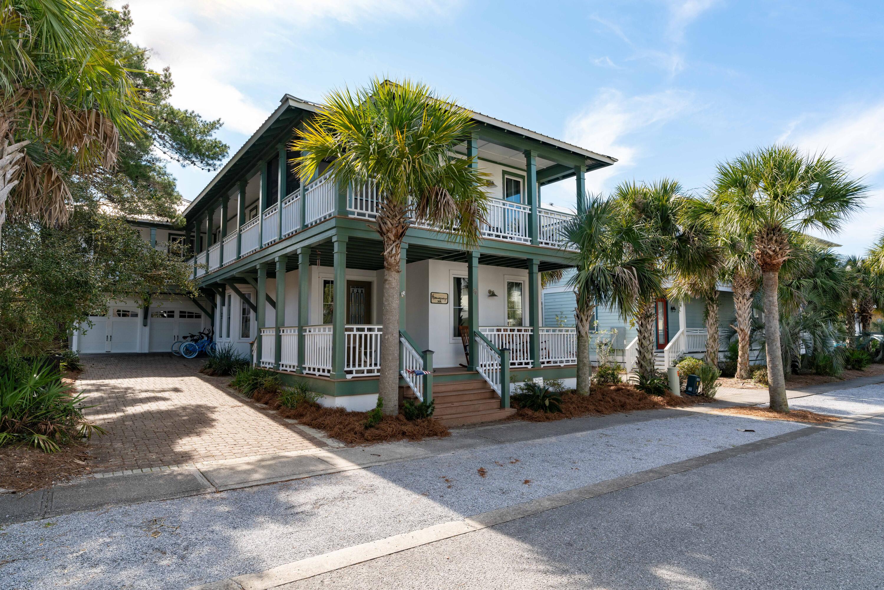 Welcome home! Offering 2 master suites, bedroom on the main floor, all en-suite baths, carriage house and a two car garage... this is your opportunity to own a special piece of Paradise. Exterior features include fresh paint, a large private courtyard, room for a private pool and grilling area and located adjacent to a new green space/park. The 1,800 sq ft of wrap around porches with Trex decking is also a well received feature as our weather is porch sitting weather year round. Two of the porches are screened.The cobblestone driveway greets you as you enter 90 W Cobia Run. This unique property has a main house and carriage house over a two car garage.