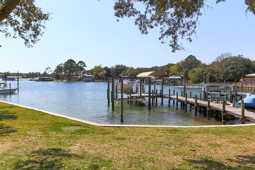 BACK ON THE MARKET -- WATERFRONT LIVING at its BEST!  This beautifully renovated 3 bed, 2.5 bath townhouse is 1 of only 4 at Sandpiper Cove that sits directly on Cinco Bayou and comes w/ a Covered Boat Slip & Boat Lift!  The kitchen has been renovated with new granite countertops, stainsteel steel appliances and an amazing water view!  The 3 bedrooms are located upstairs with the spacious Master Suite, on one side overlooking the Bayou.Boating, fishing, kayaking, paddle boarding and so much more, not to mention the beautiful sunset views from the stone porch or screened in patio.  Roof is 2016, Water Heater is 2022, HVAC is 2013.Buyer to verify all measurements and any information deemed important.