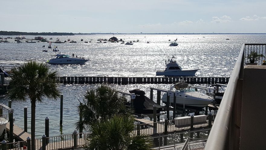 Watch the dolphins play and take in the beauty of the harbor & inlet from this beautiful condo! Secure gated condo, 3 bedrooms, 3 full bathrooms, 2038 square feet overlooking Destin Pass and Crab Island. Enjoy watching dolphins, occasional manatees, fireworks, and daily spectacular sunsets from your balcony. Built in 2004 and completely renovated in 2012 with new paint, carpet, refrigerator, cooktop, washer, dryer, Hunter remote ceiling fans and light, Invisiguard solar window film. 50 pound icemaker, beverage/ wine cooler, & Bali custom solar shades added in 2014. Reserved covered parking directly below the unit, with dedicated lockable storage on same floor. Common areas include BBQ grills, waterfront gazeebo and pool, community room available for large gatherings includes exercise